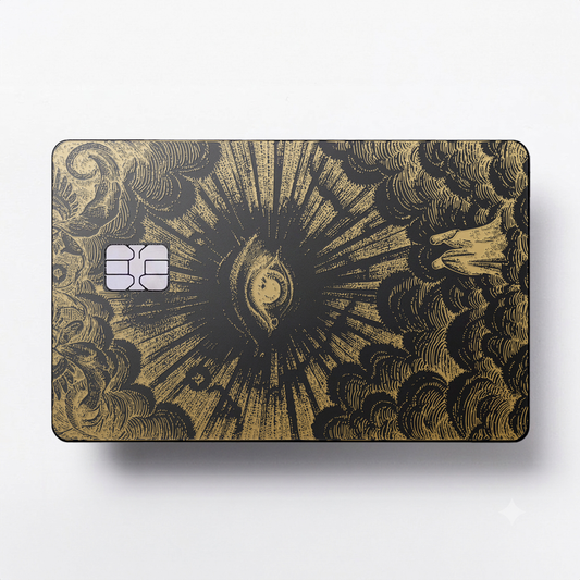 Celestial Eye luxury metal card with ornate engraved artwork in matte black and gold finish