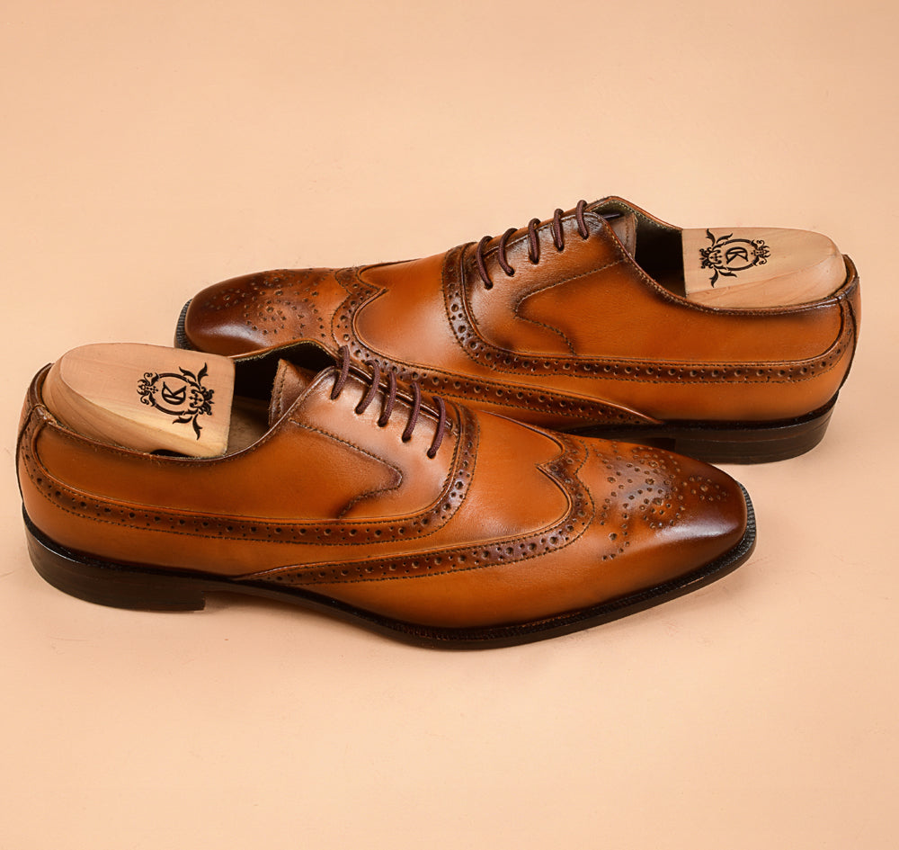 The Wingtip Tan Patina Oxfords