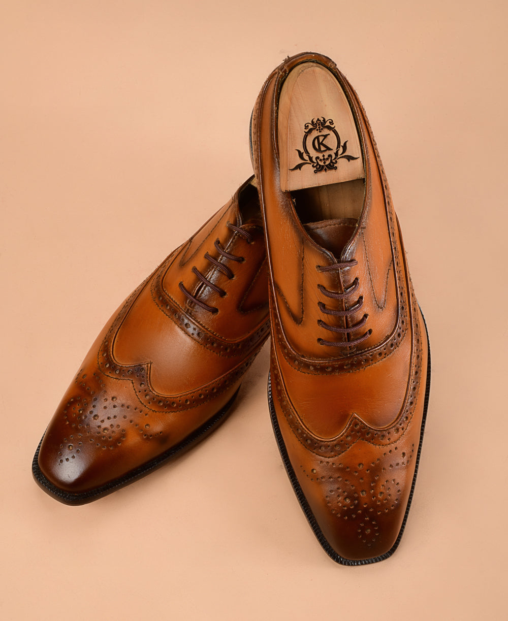 The Wingtip Tan Patina Oxfords