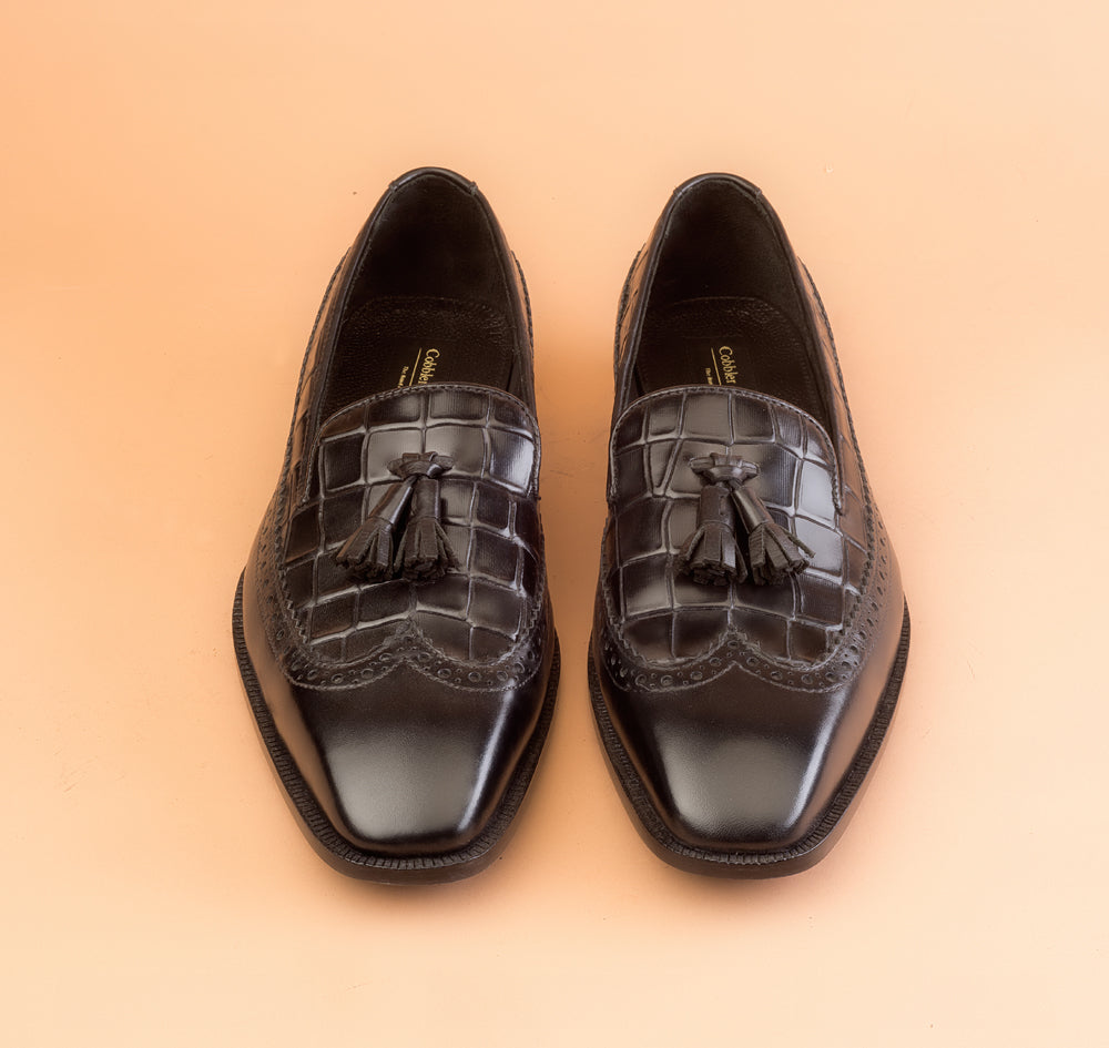 The Whole Cut Black Tassel Loafer