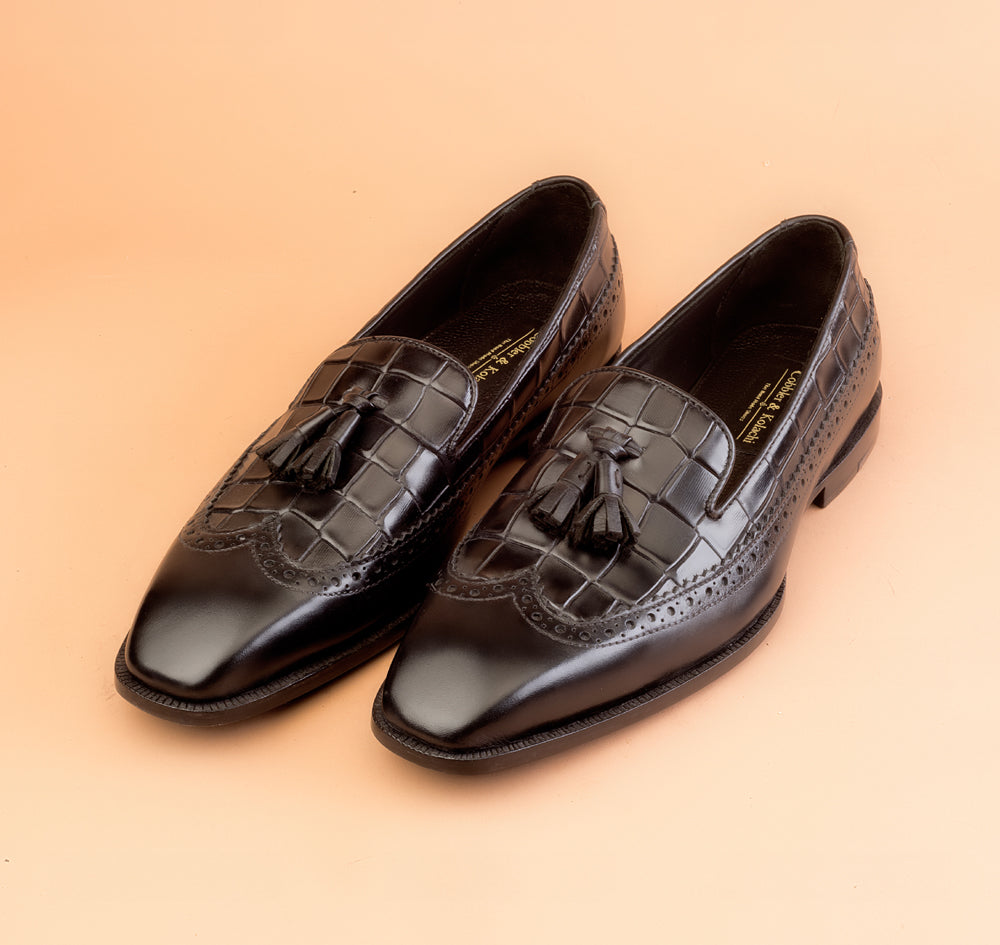 The Whole Cut Black Tassel Loafer