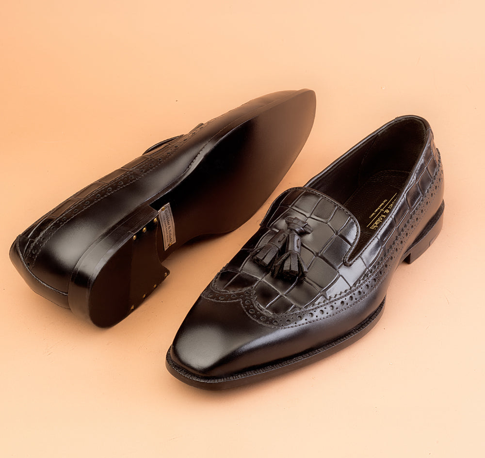 The Whole Cut Black Tassel Loafer