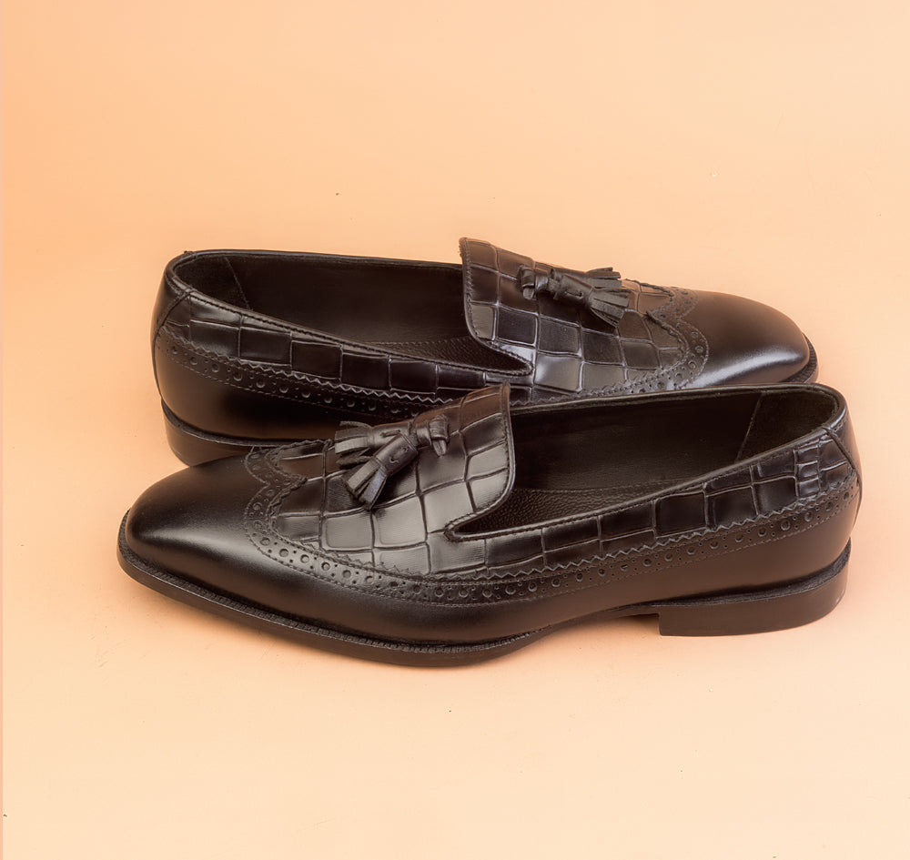 The Whole Cut Black Tassel Loafer